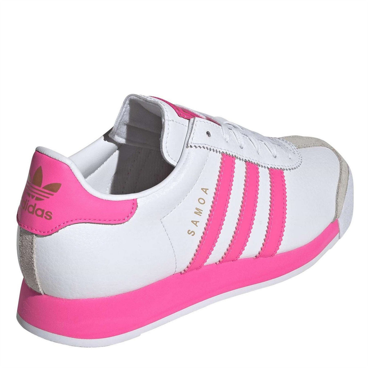 White low-top walking shoes for juniors with pink heel tab, padded collar, lace-up fit.
