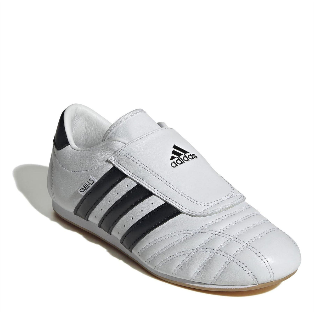 White leather low-top trainers with adidas badge on hook strap and black stripes