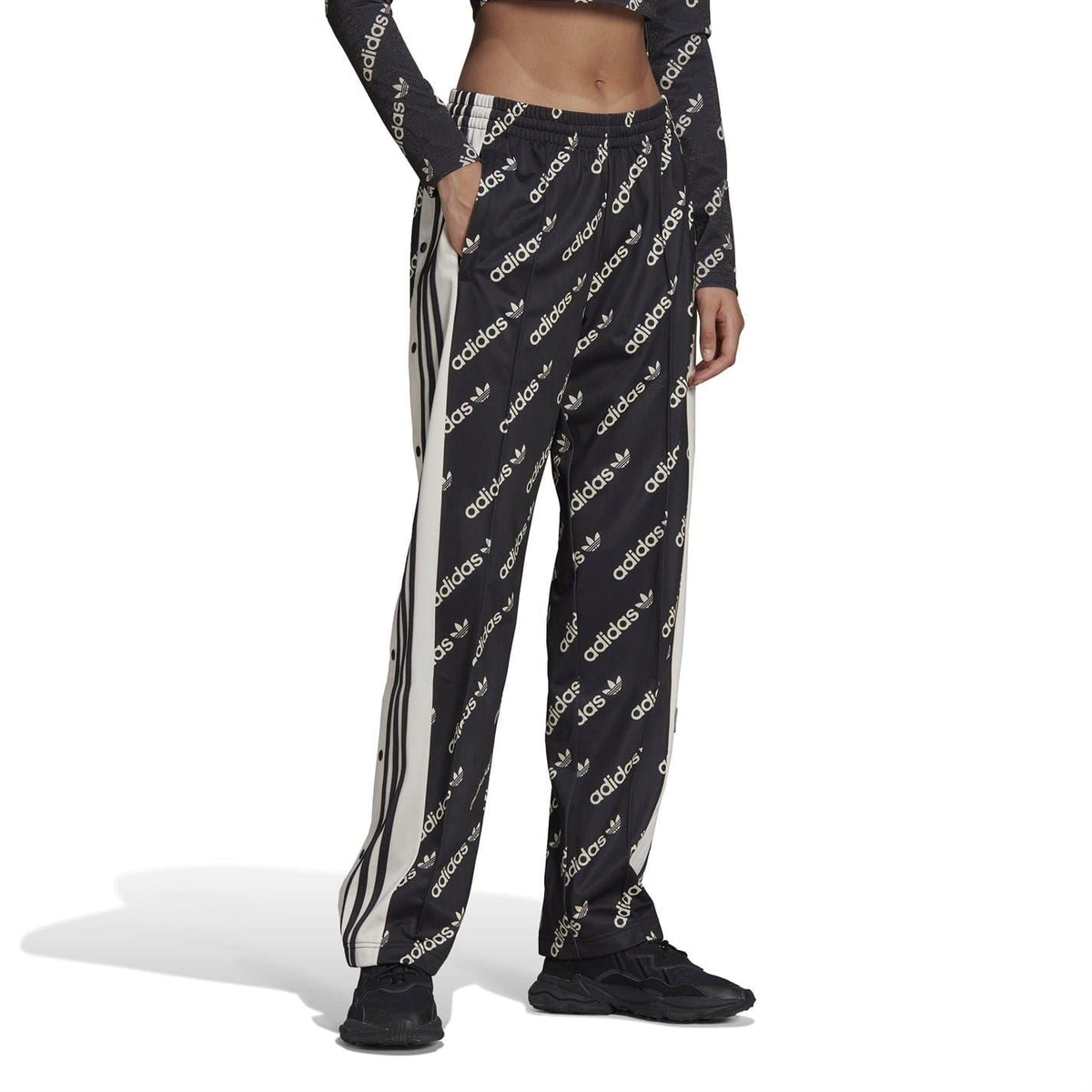 Black adidas-logo track style jogger sweatpants with vertical side stripe detailing