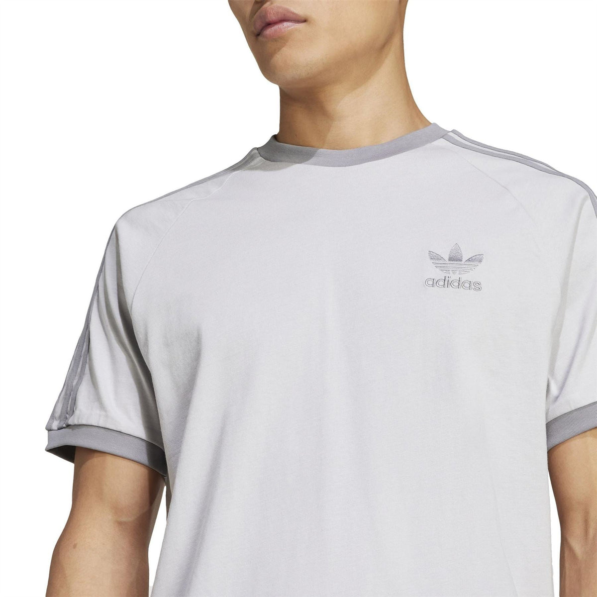 Light grey adidas T-shirt with crew neck trim and small adidas logo