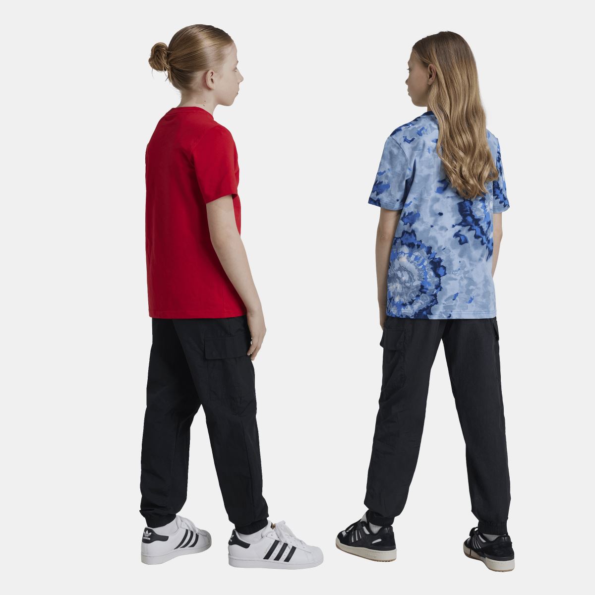 Black cargo track pants on two children, featuring elastic waist and cargo pocket styling