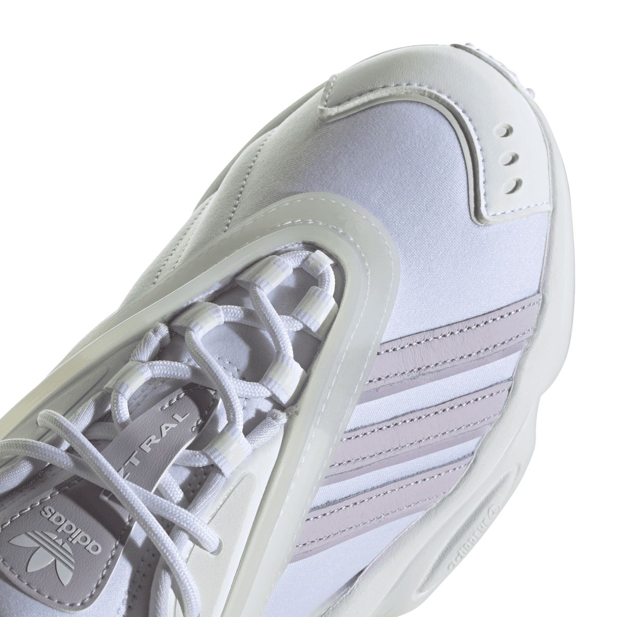 Close-up of white adidas Originals Oztral lace-up sneaker with three-bar side stripe detail