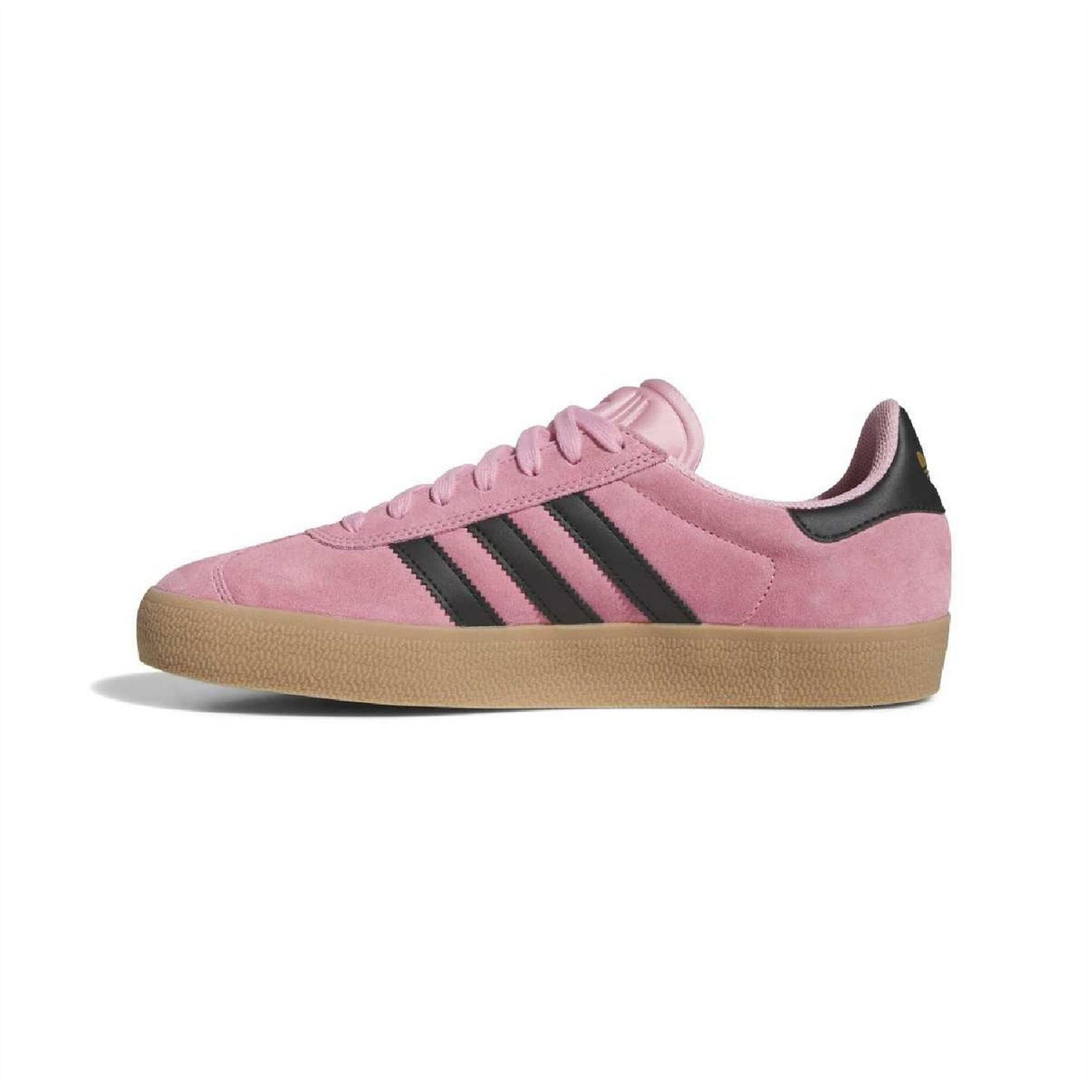 Light pink suede trainers with lace-up front, black stripes, and gum rubber sole