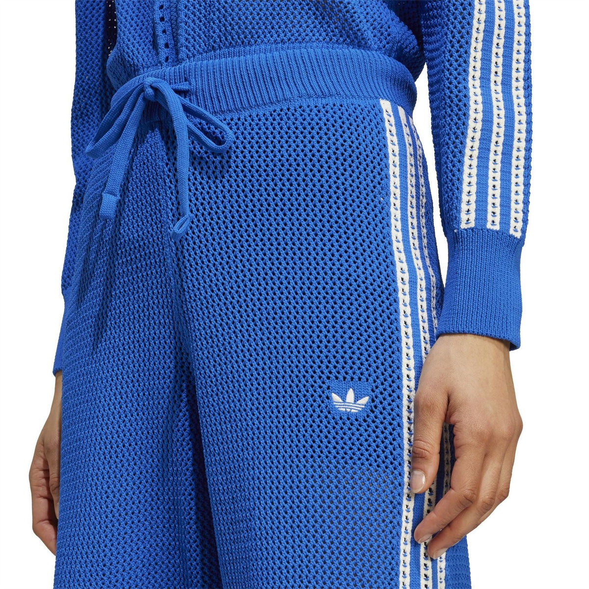 adidas Originals crochet track pants detail: blue drawstring waist and trefoil logo
