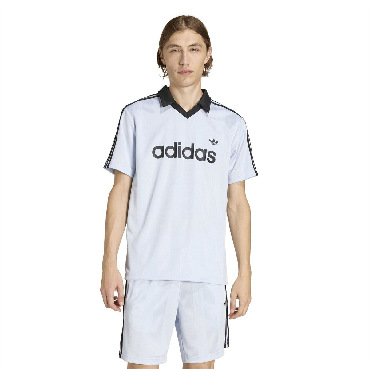 Light blue adidas polo shirt with black collar, short sleeves, and side stripes