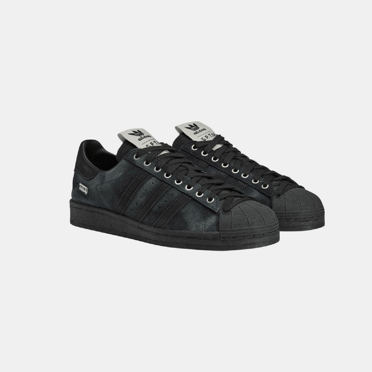 adidas Originals SFTM Superstar 82 trainers in white leather with classic shell toe and vintage-inspired design, perfect for casual wear