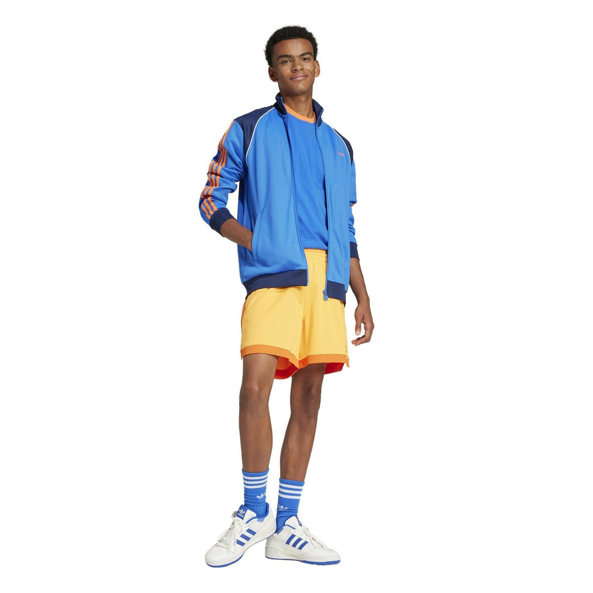 adidas Originals yellow shorts with elastic waist, orange trim, and side stripe accents