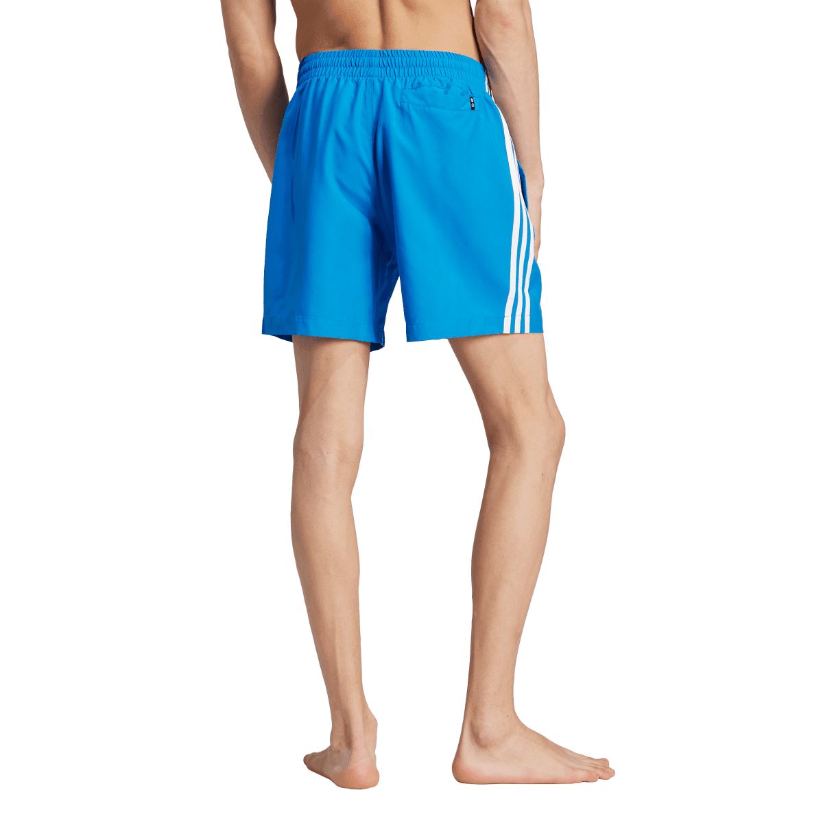 Blue adidas swim shorts with three white side stripes and drawstring waist