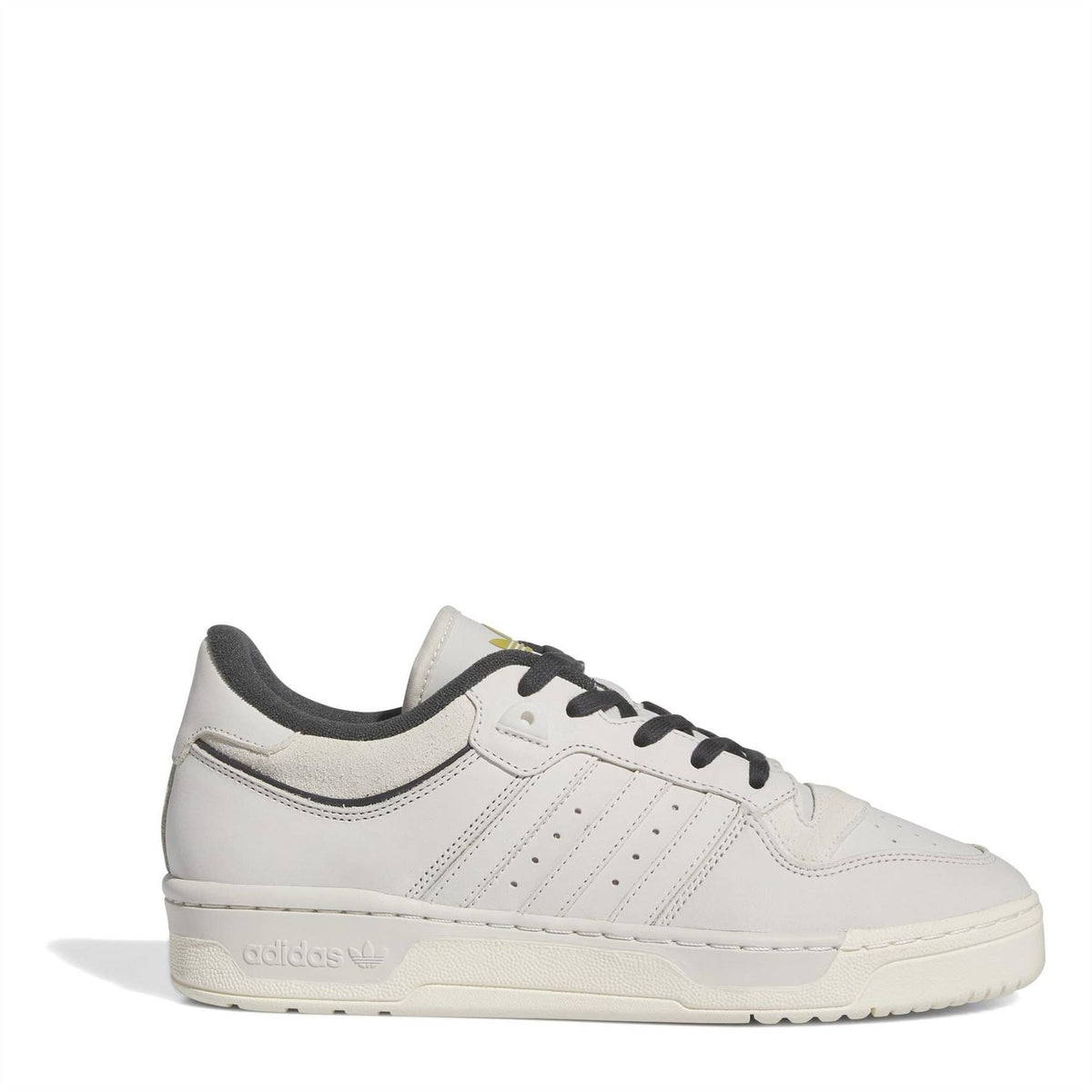 White low-top leather-look sneakers with black laces and three side stripes