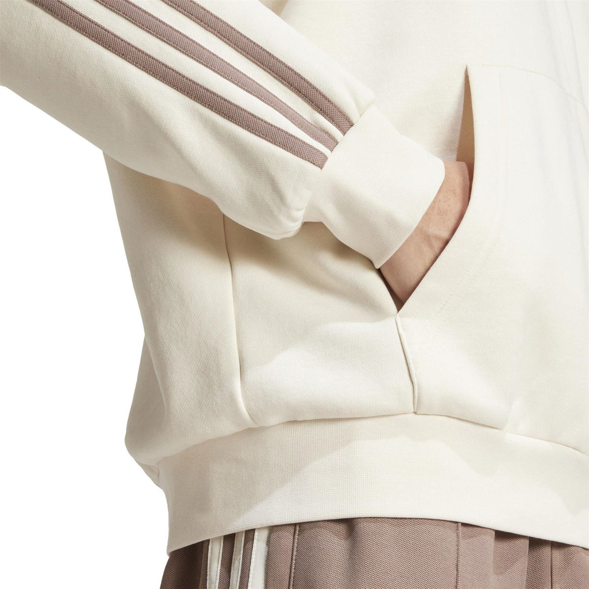Off-white hoodie detail showing kangaroo pocket, drawstring hem, and three stripe sleeve.