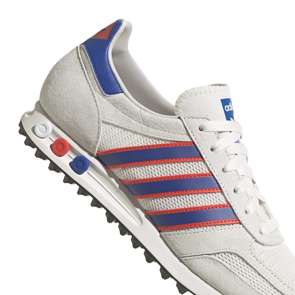 Men's adidas Originals LA trainer close-up with blue collar and red striped sidewall