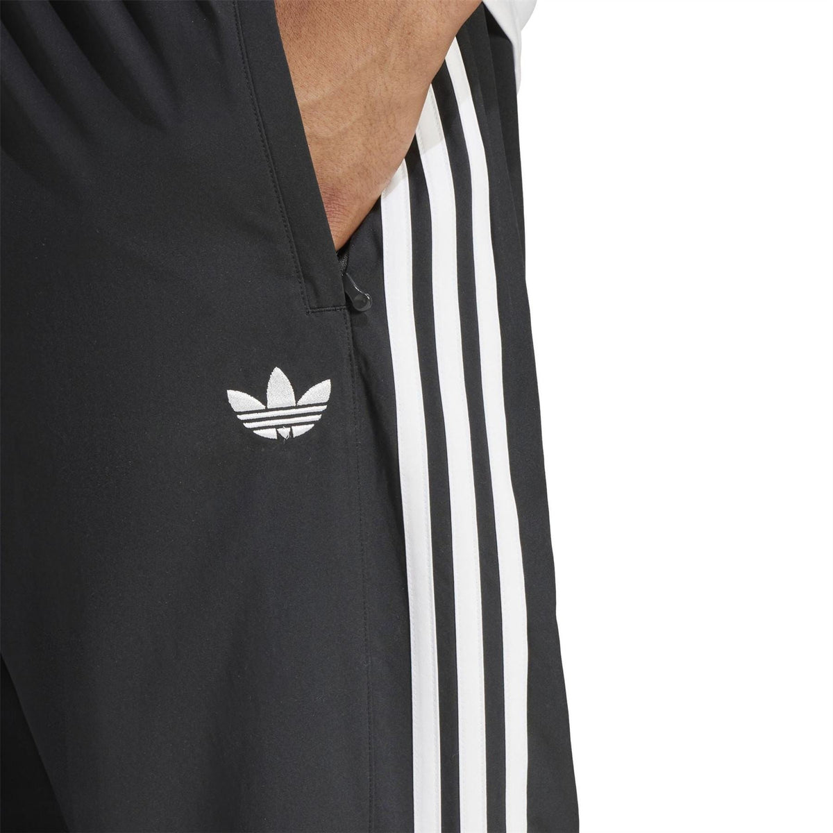 Black adidas Originals track top with trefoil logo and white triple stripes panel