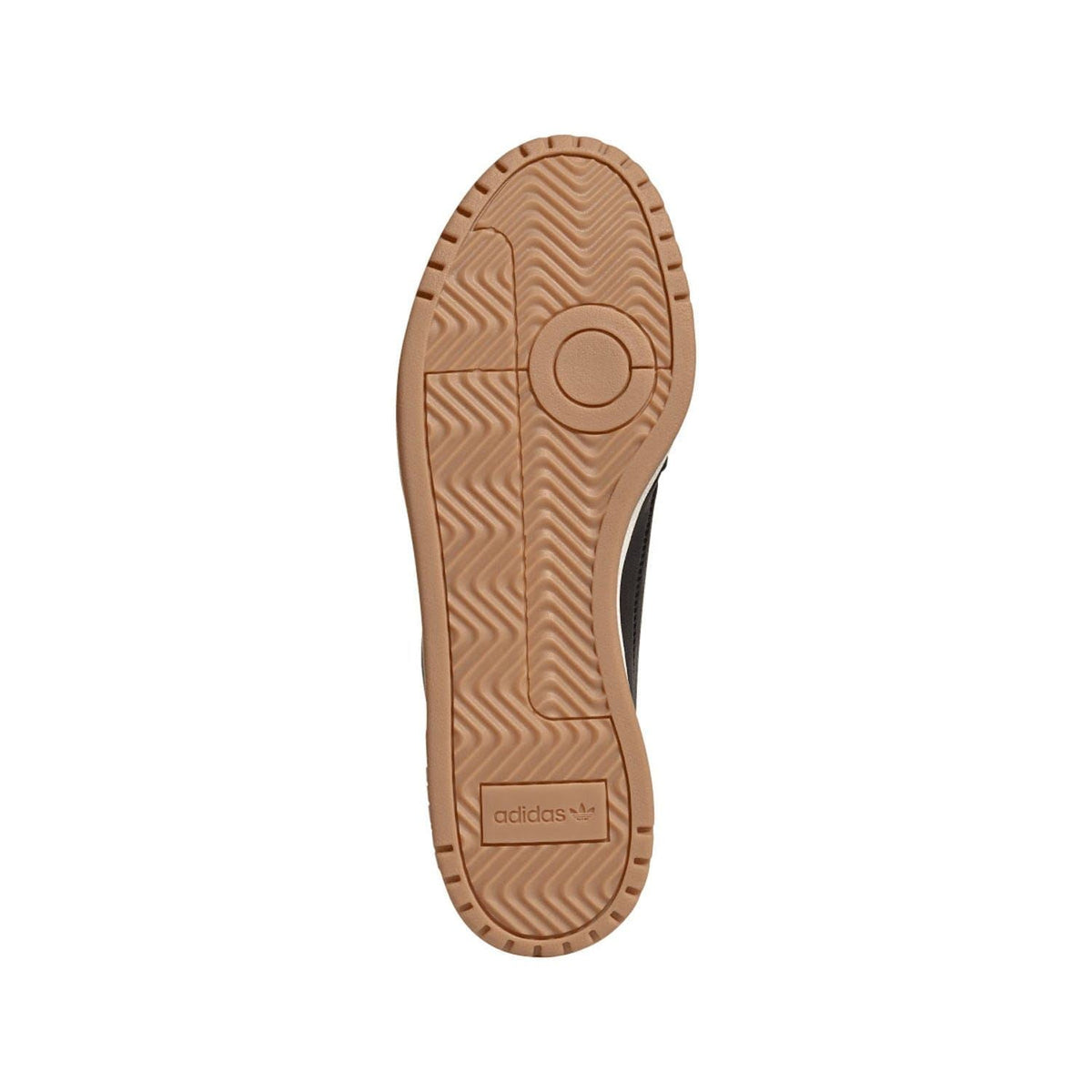 Trainer outsole with rubber tread pattern and adidas label on heel