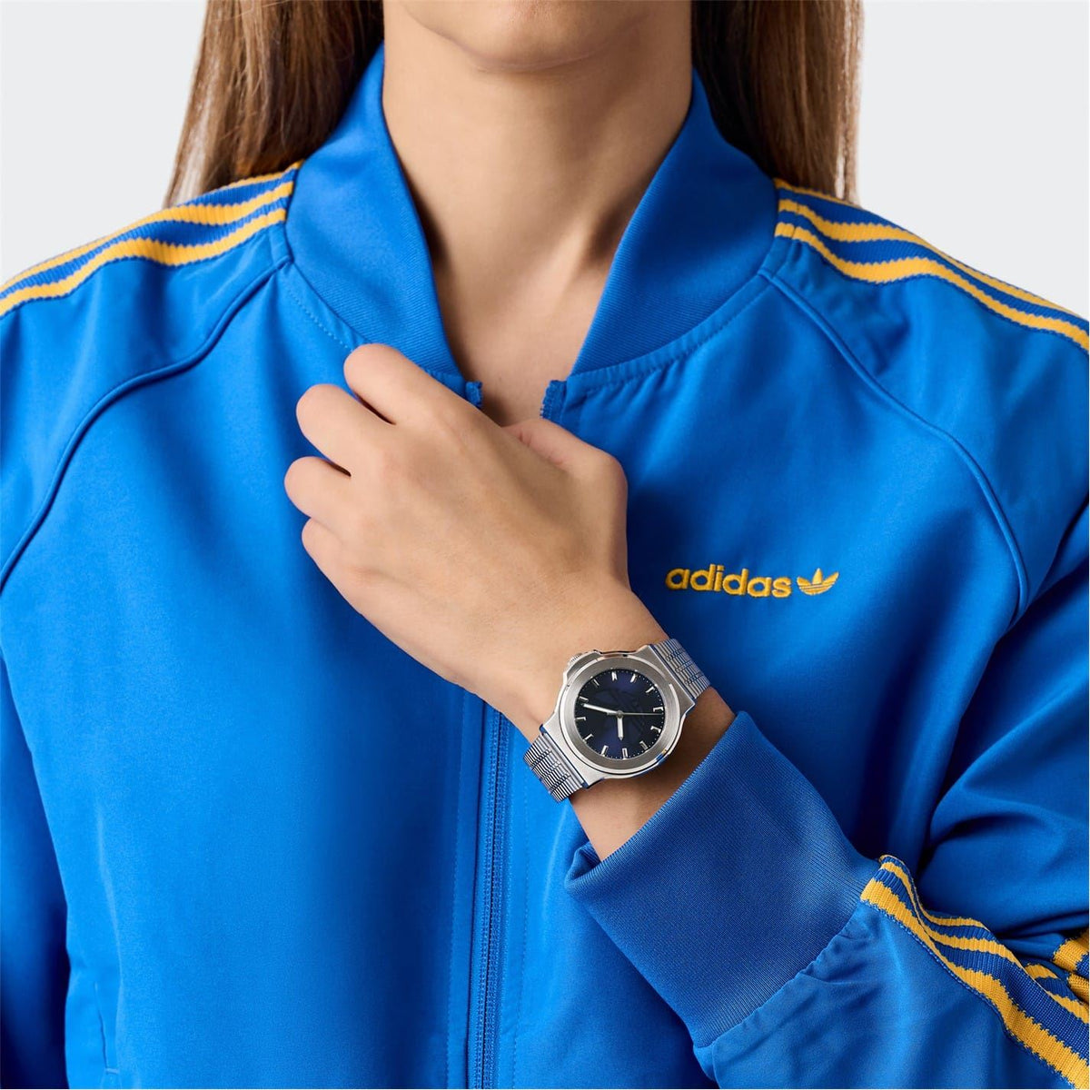 adidas Originals analog watch on wrist, dark blue dial, silver mesh bracelet