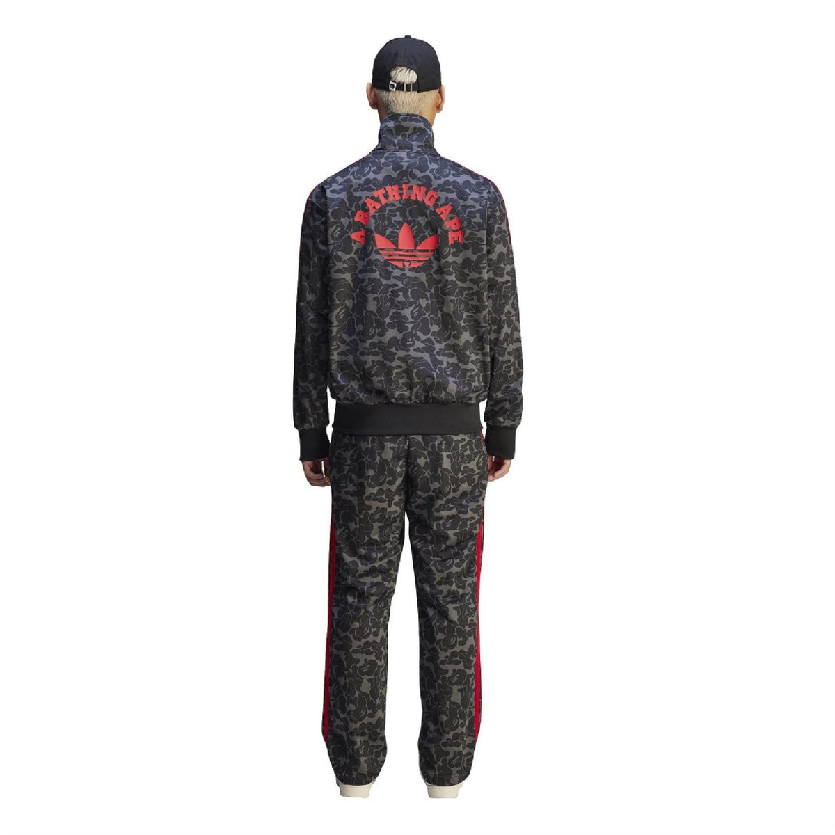 Black camo track pants with red side stripes and back trefoil graphic