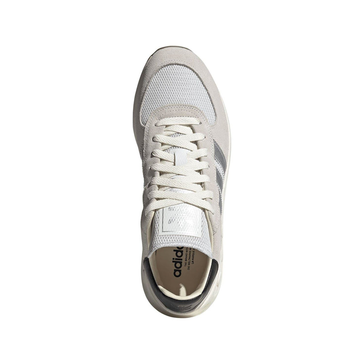 Light-grey and white lace-up sneaker with textured upper and dark inner collar lining