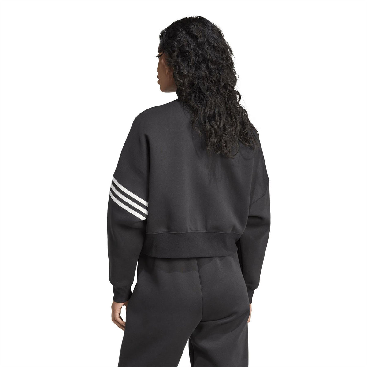 Black track top back view with contrast white striped sleeve band and ribbed cuffs