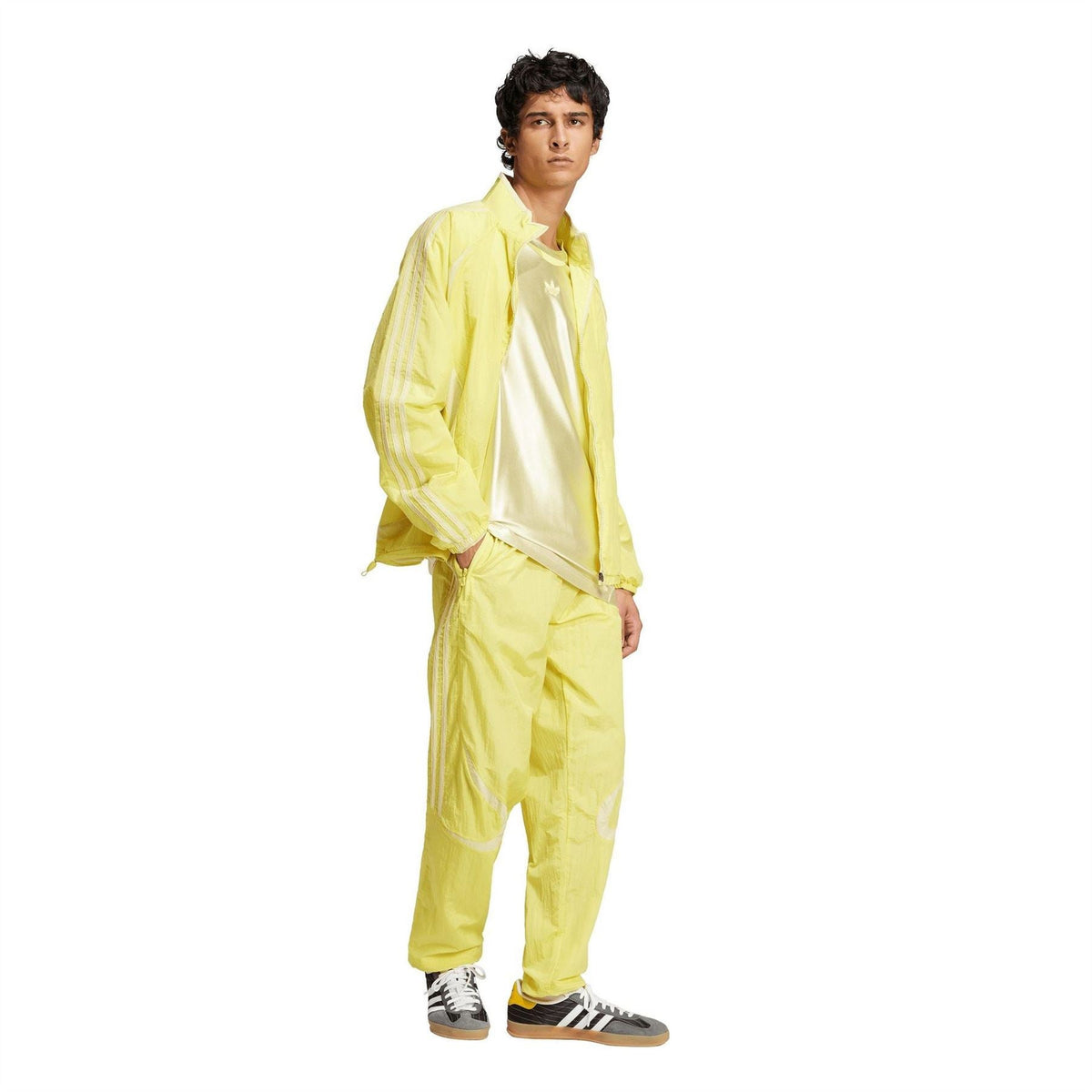 adidas Originals yellow track jogger pants with elastic waist and striped side panels