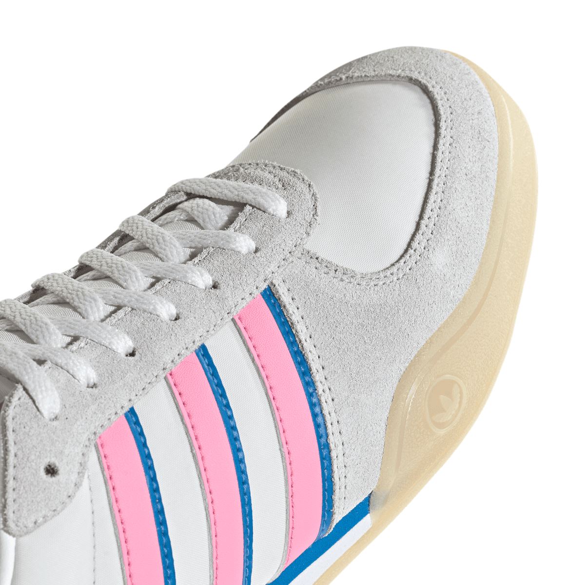 Close-up of adidas Originals indoor sneaker side: grey suede, pink/blue triple stripes