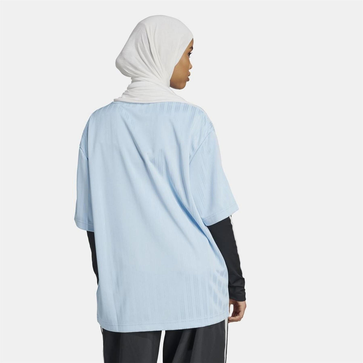 Light blue adidas Originals T-shirt from back view, showing relaxed fit and stripes