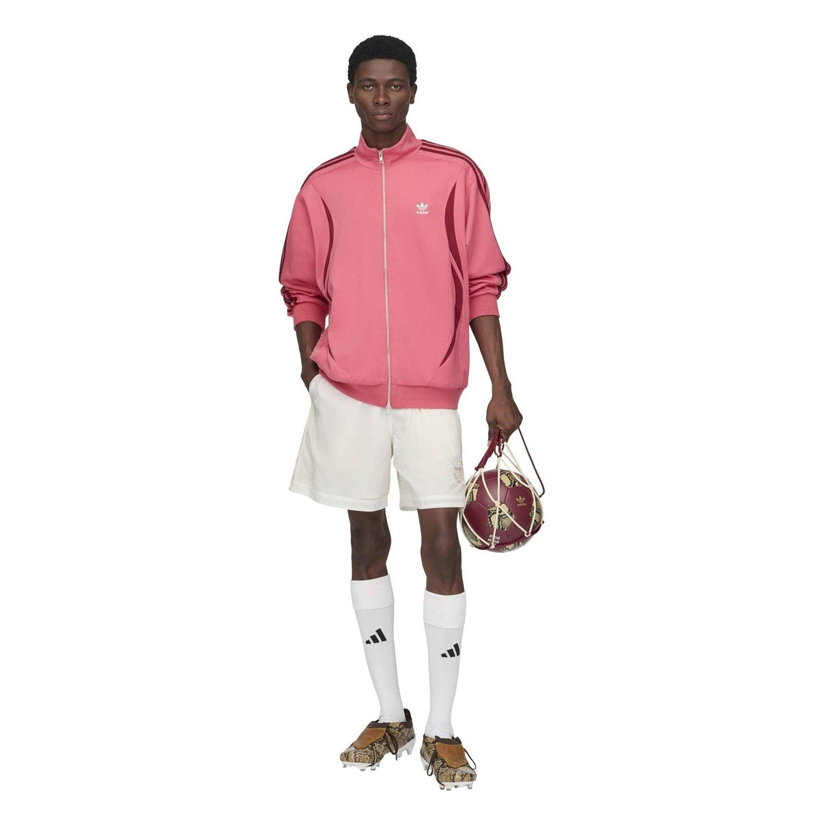 Craft Pink track jacket worn with white shorts and striped socks