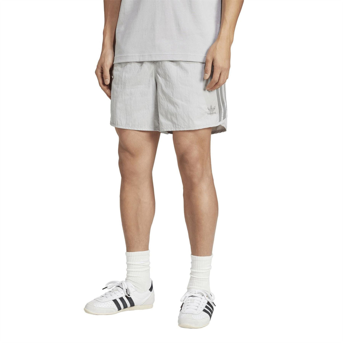 Light grey Sprinter shorts with elastic waistband and adidas logo at right hem