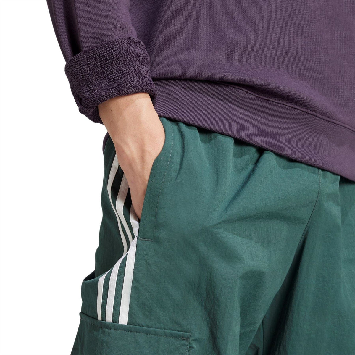 Purple sweatshirt sleeve and hem with ribbed cuff and smooth knit finish.