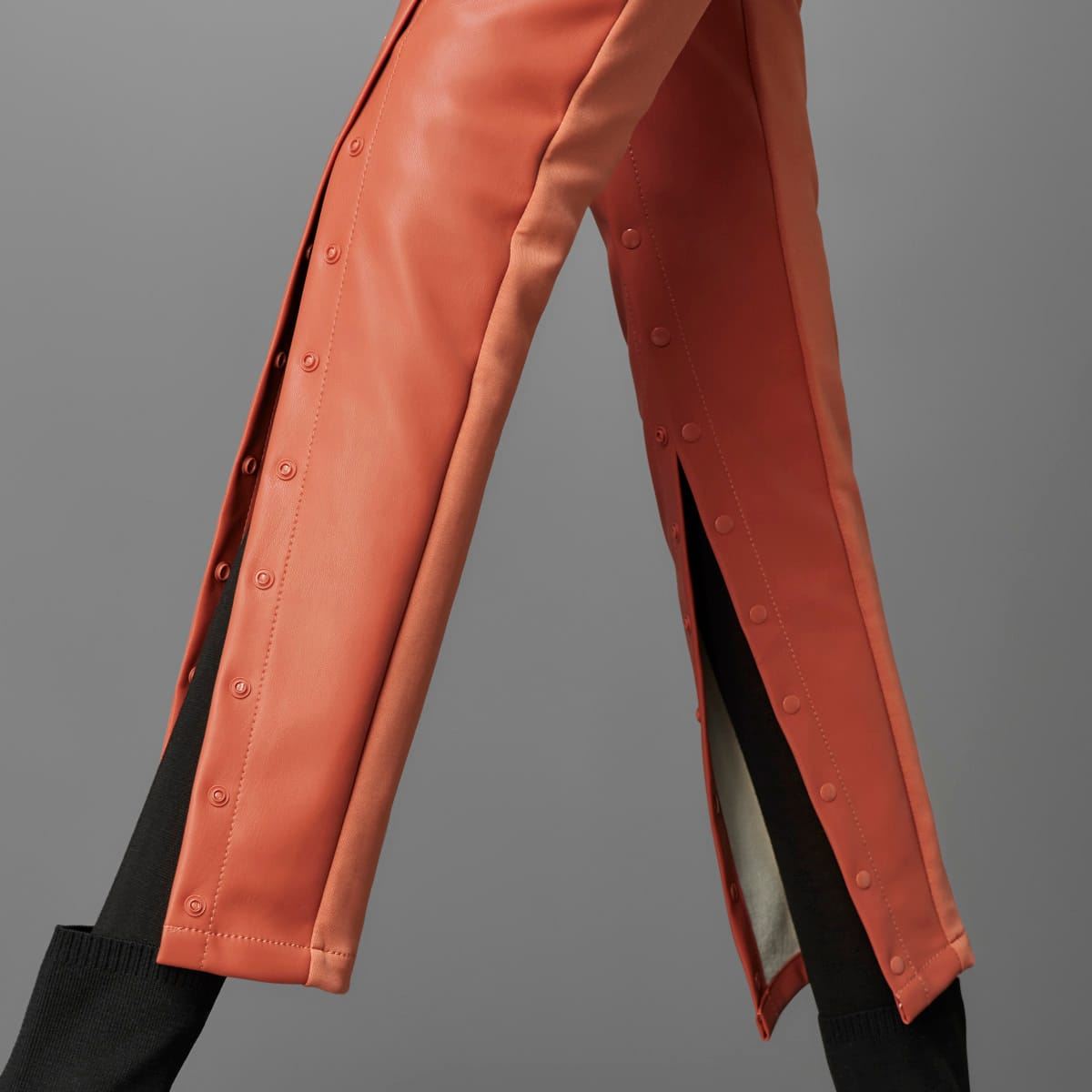 Black adidas Originals Slim Pant trousers featuring a sleek fit and classic branding, perfect for casual and athletic wear.