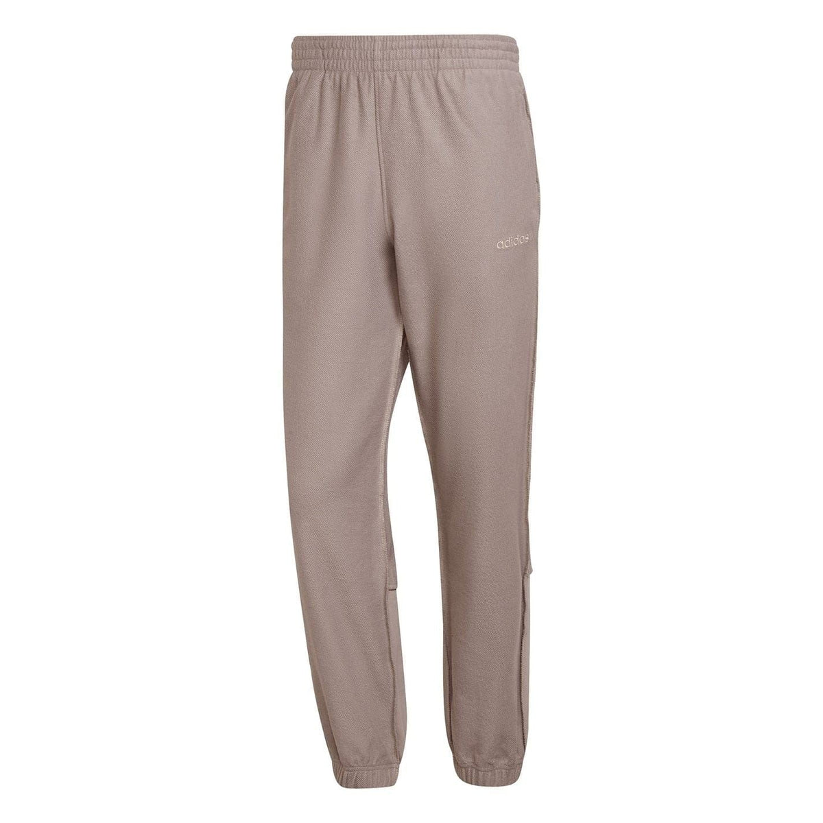 Taupe jogger pants with elastic waist and drawstring, tapered legs, cuffed hems.