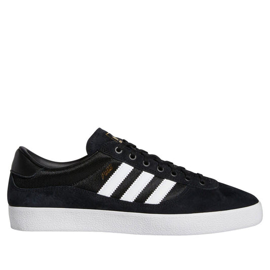 Black low-top indoor trainer with three white adidas stripes and lace-up front.