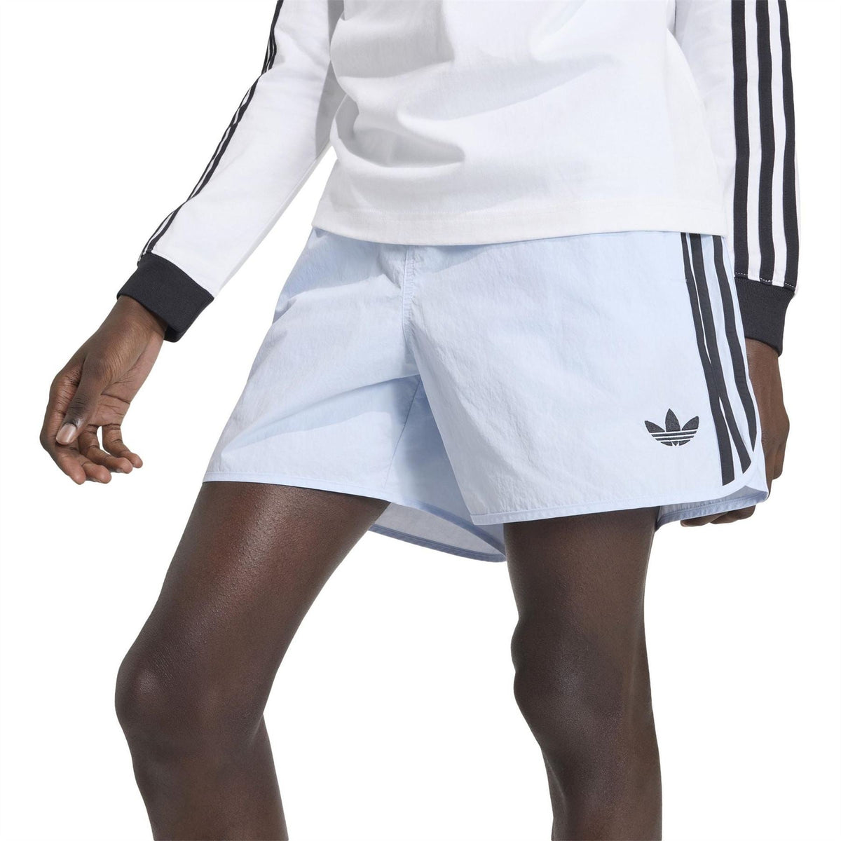 Light blue above-knee shorts with side trefoil logo and pleated front