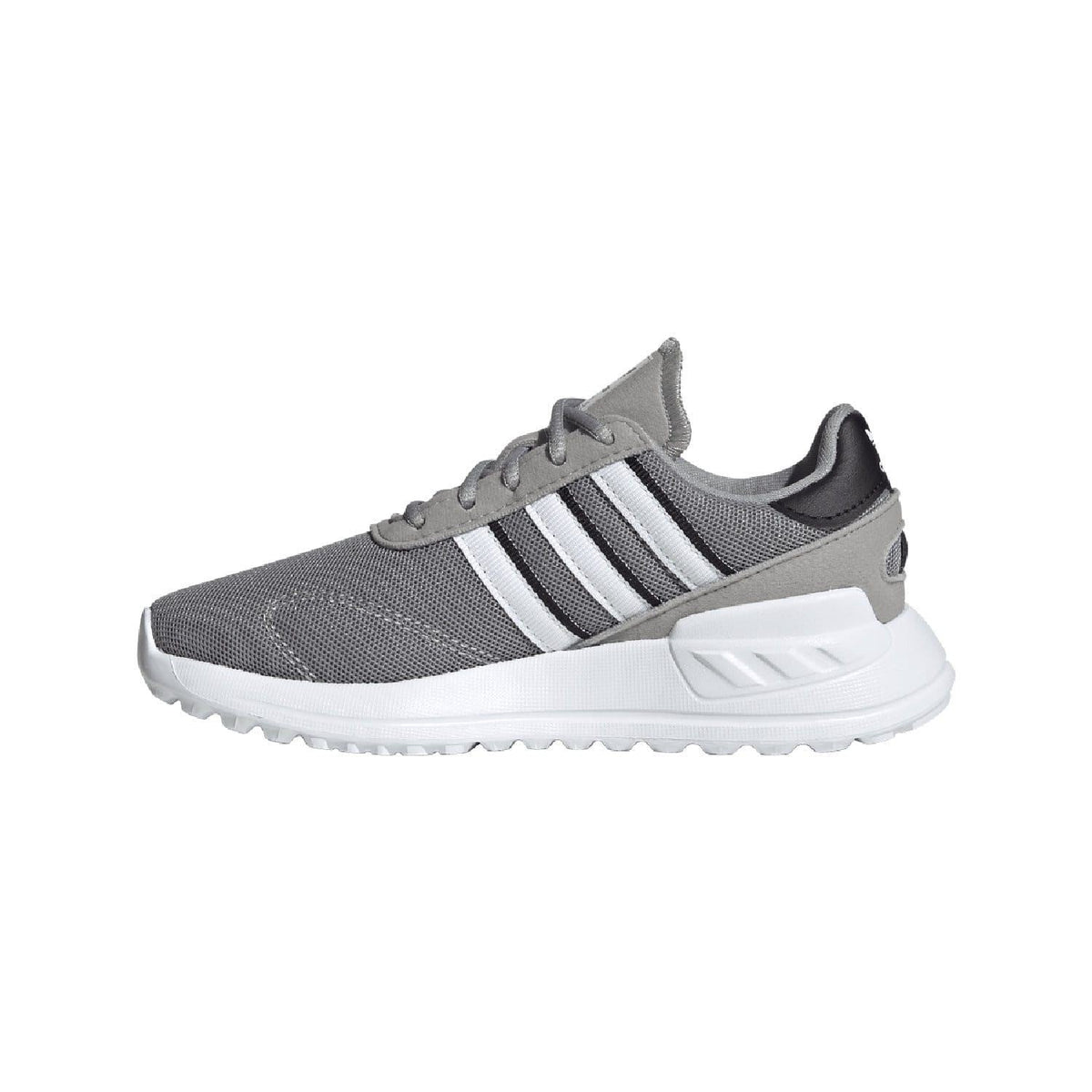 Grey kids trainer with white stripes and chunky white midsole cushioning