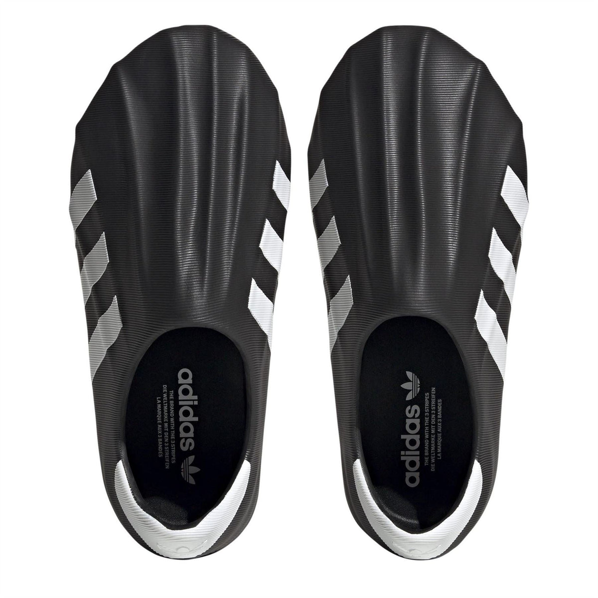 Adidas Originals Superstar Slip On Junior Trainers in size 3-5, featuring classic white design with navy accents and comfortable slip-on fit.