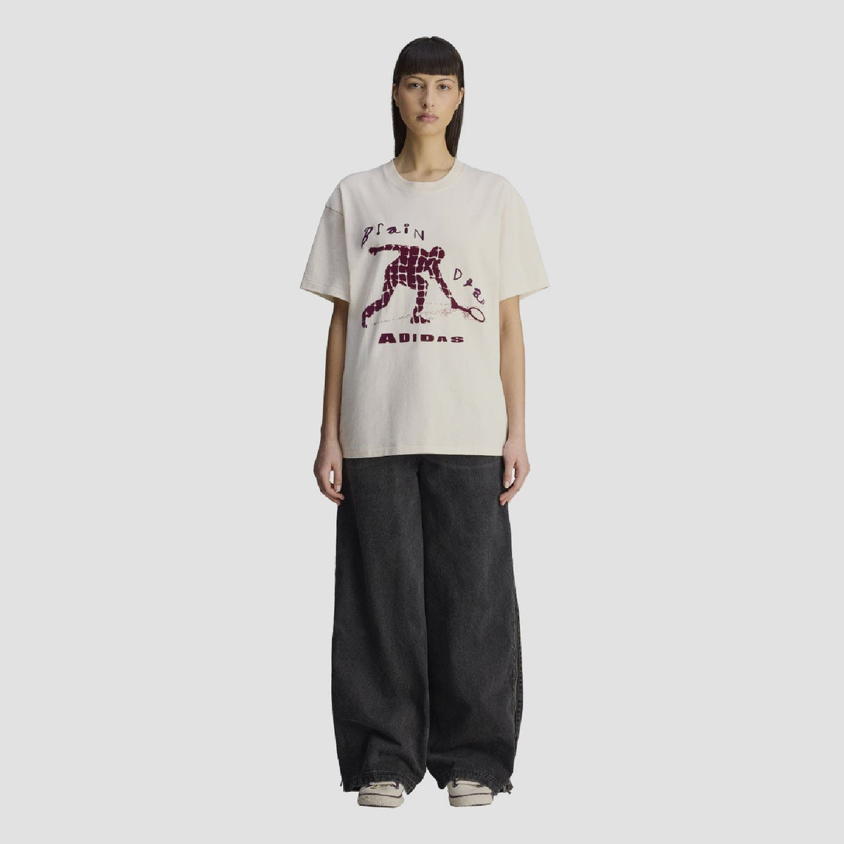 Cream T-shirt with purple robot graphic and 'ADIDAS' lettering, crew neck