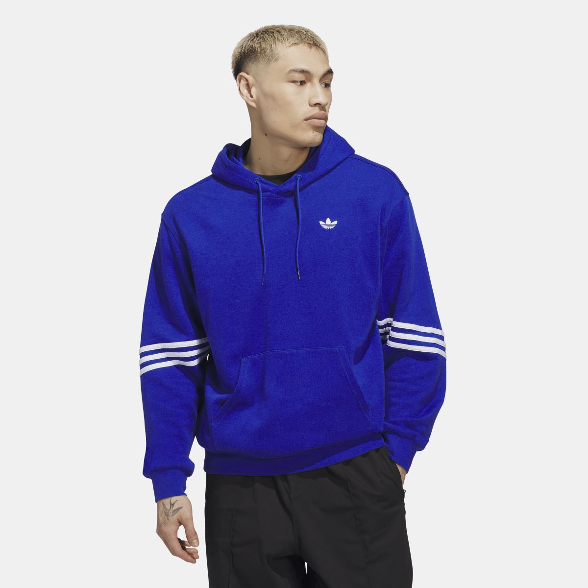 Blue adidas Originals skate hoodie with trefoil logo, drawstring hood, and stripe sleeves.