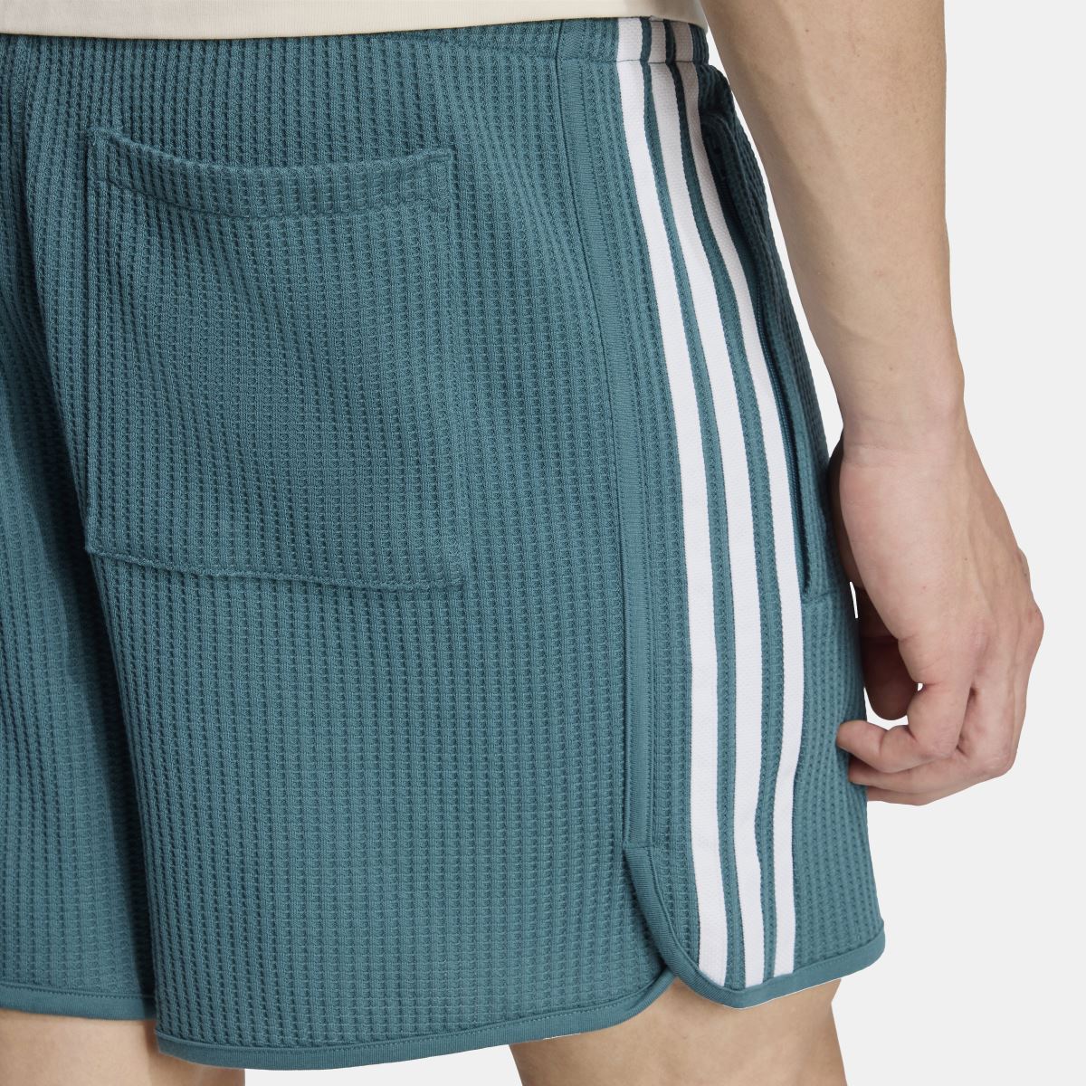 Waffle knit sprinter shorts back detail, teal-green with striped trim and pocket