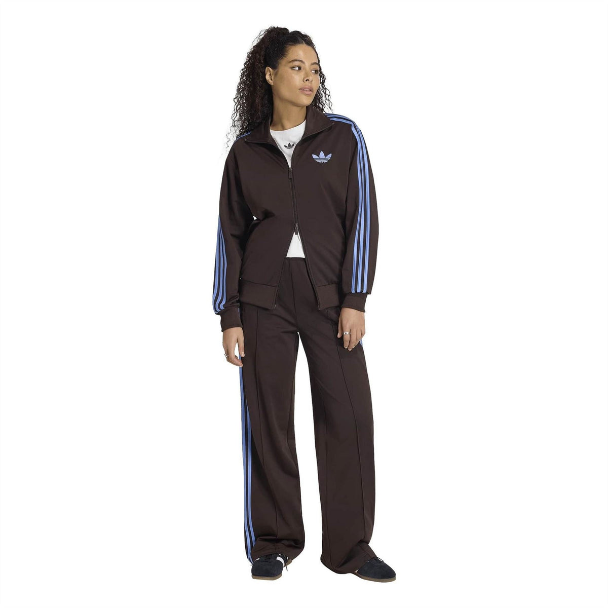 adidas Originals relaxed-fit high-neck zip top worn with track pants, blue sleeve stripes