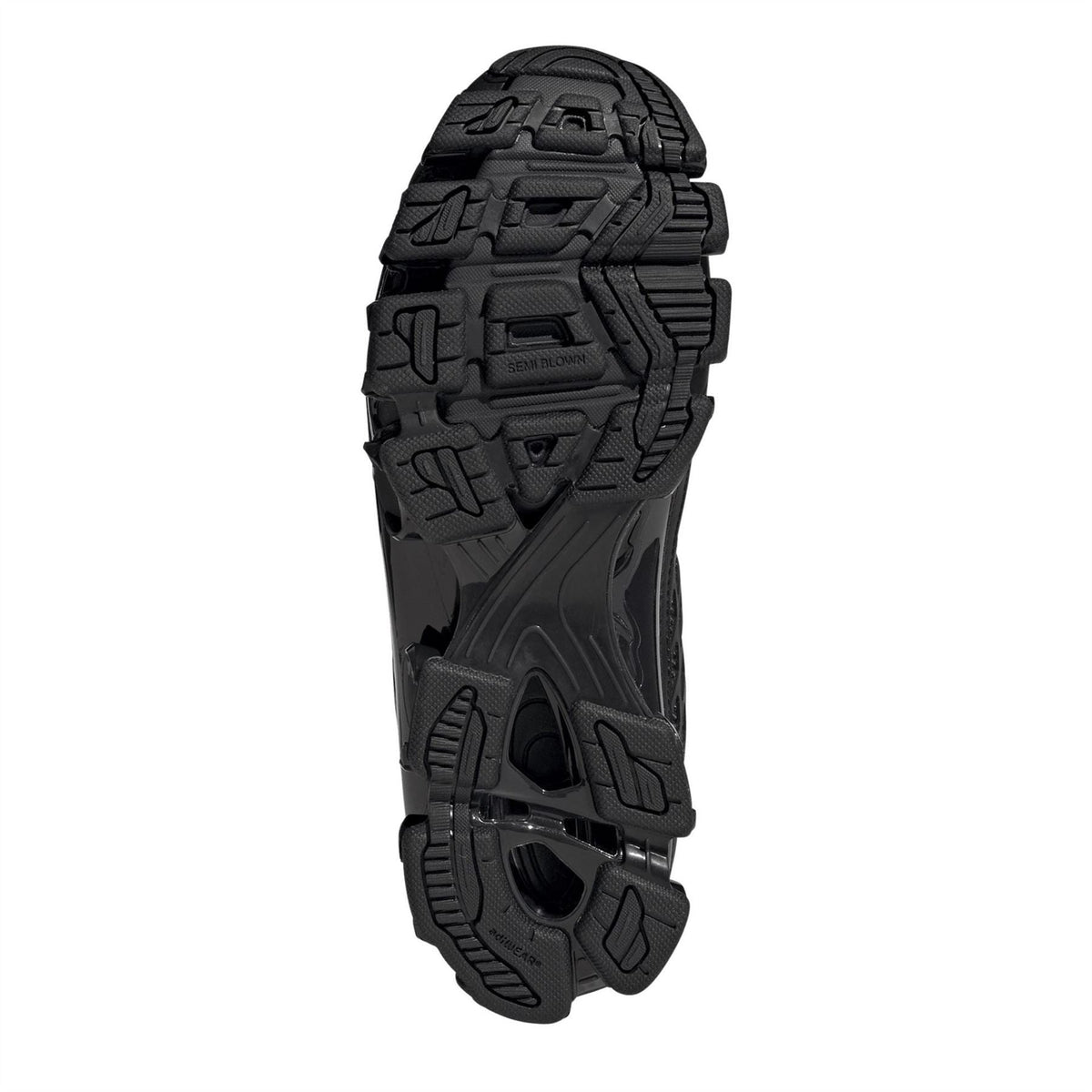 Black adidas Megaride F50 outsole with molded traction pattern and pod details