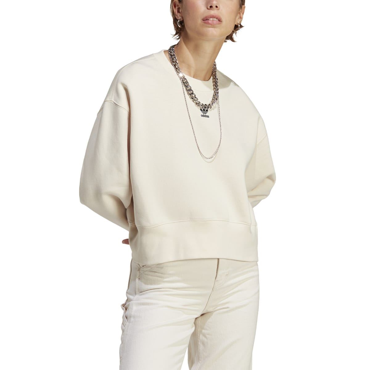 Cream crewneck sweatshirt, close side view with ribbed crew neck and sleeves.