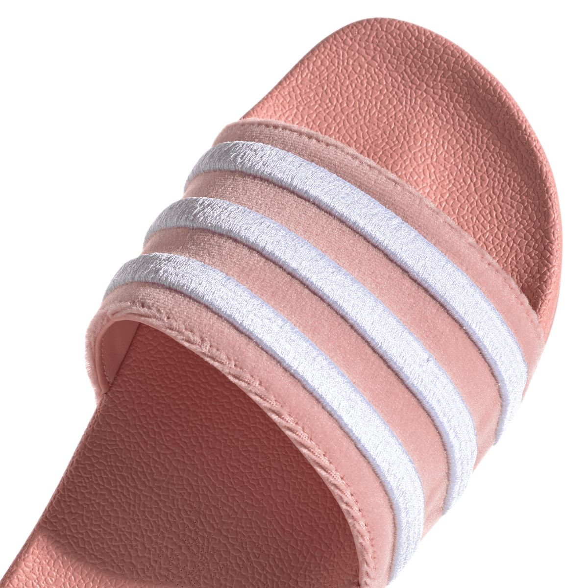 Mauve adidas Adilette slide sandal upper close-up with three white stripes