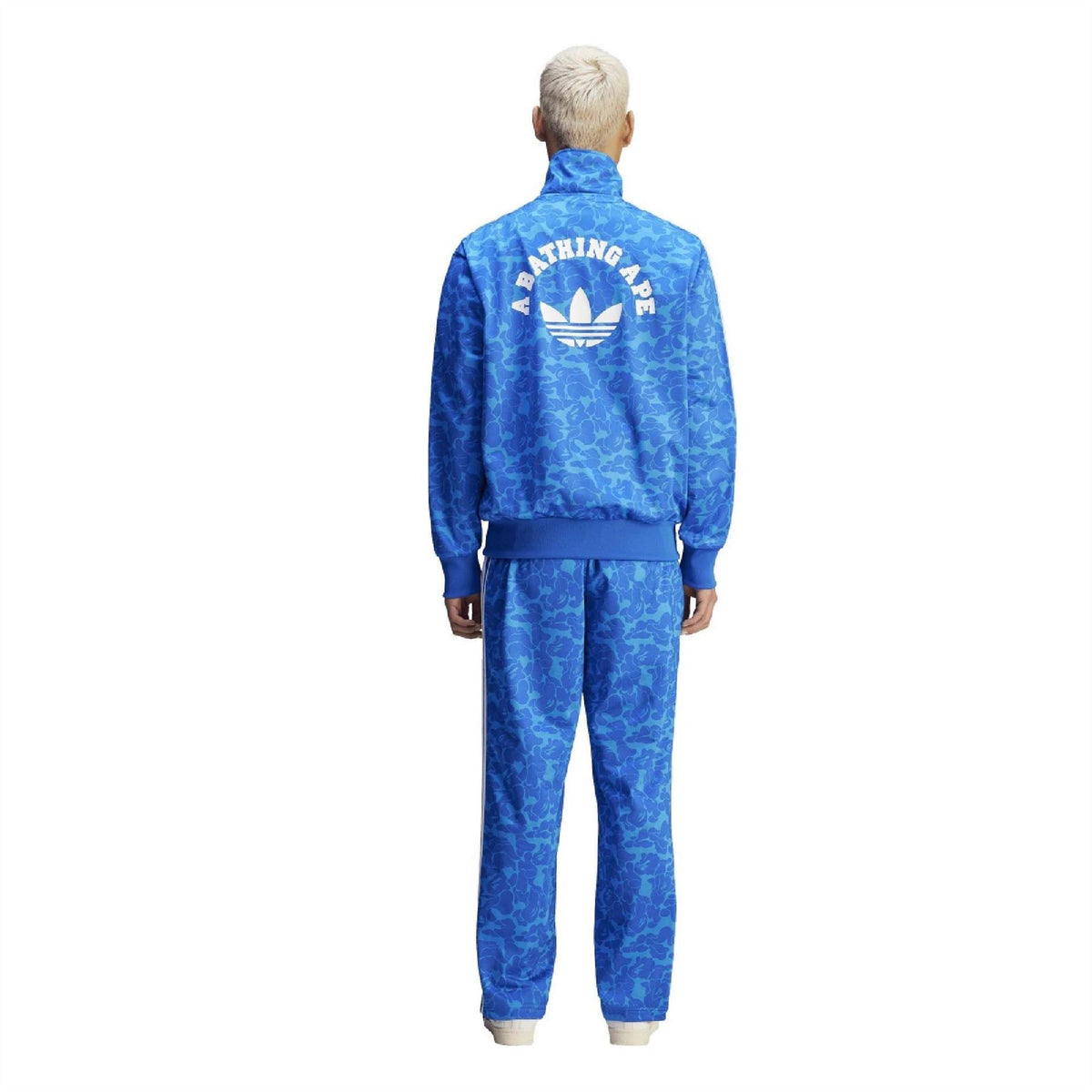 Blue camo track pants with elastic waist and white side triple stripes, view from back