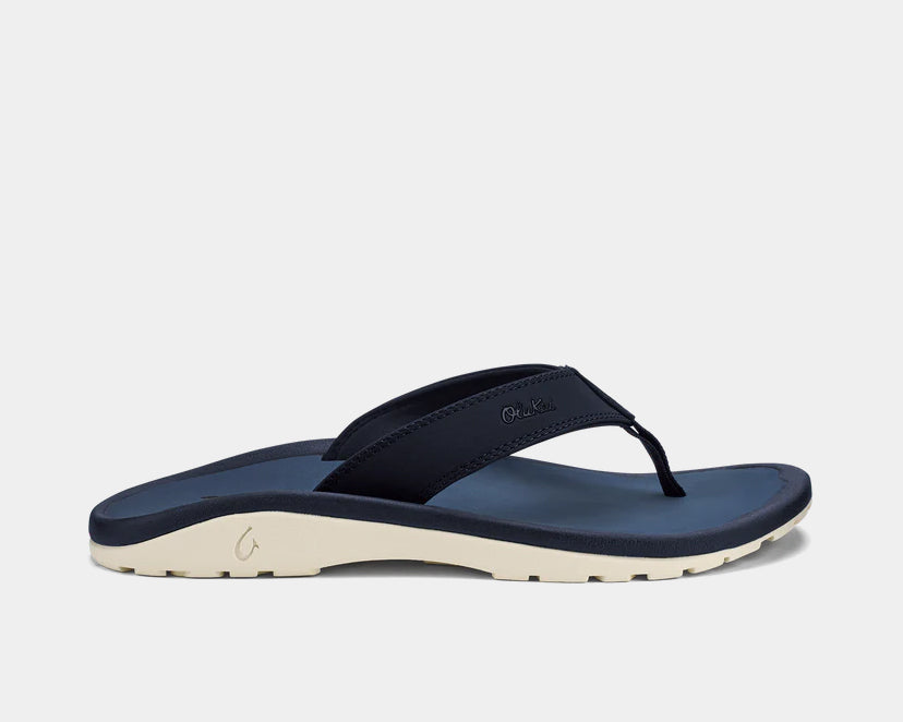Navy thong sandals with cream midsole and OluKai logo
