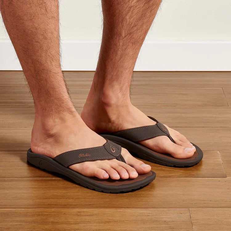 Brown thong flip-flops on model feet with cushioned straps