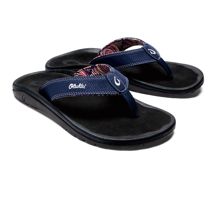 Flip-flop sandals with dark blue straps and multicolor patterned toe thong