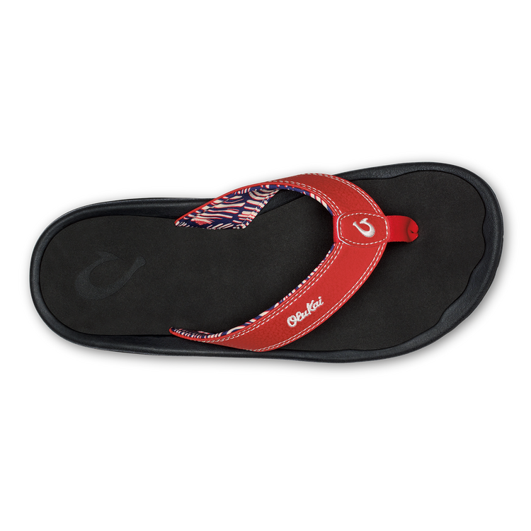 Red and black thong sandals with patterned strap and OluKai logo