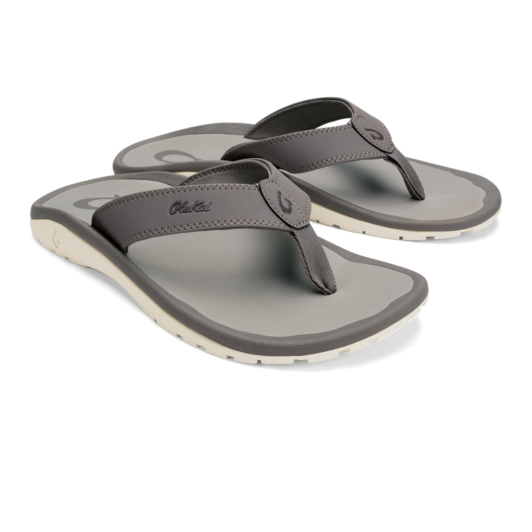 Flip-flop sandals with gray straps and contrast light sole with traction tread