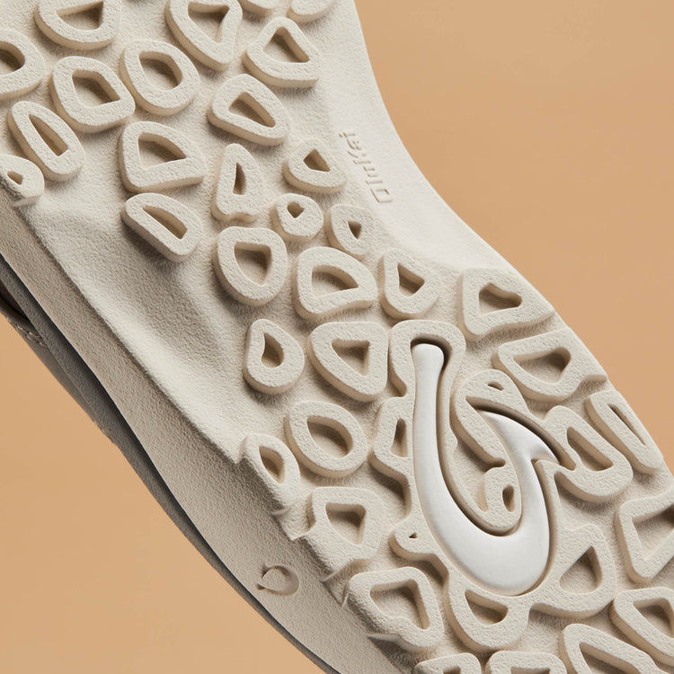 Close-up of light tan textured outsole tread for thong sandals