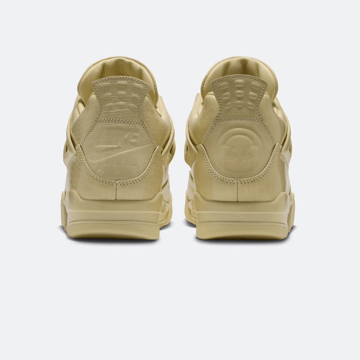 Yellow sneaker pair, rear view with heel tabs and sculpted back panels
