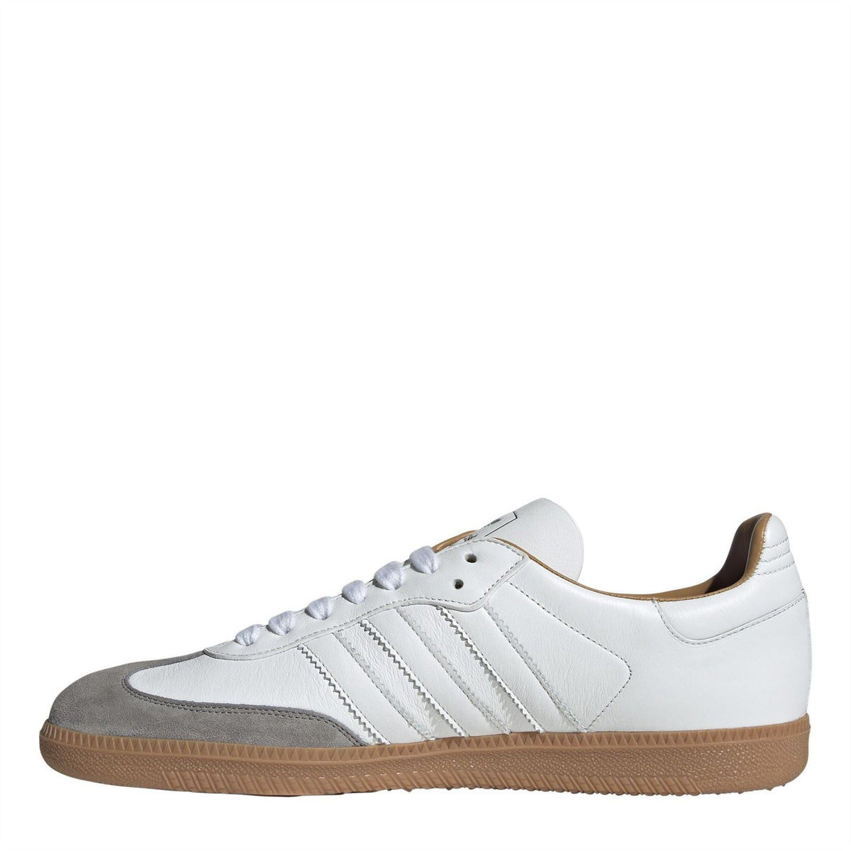 White and gray low-top sneakers with adidas-style stripes and gum rubber sole