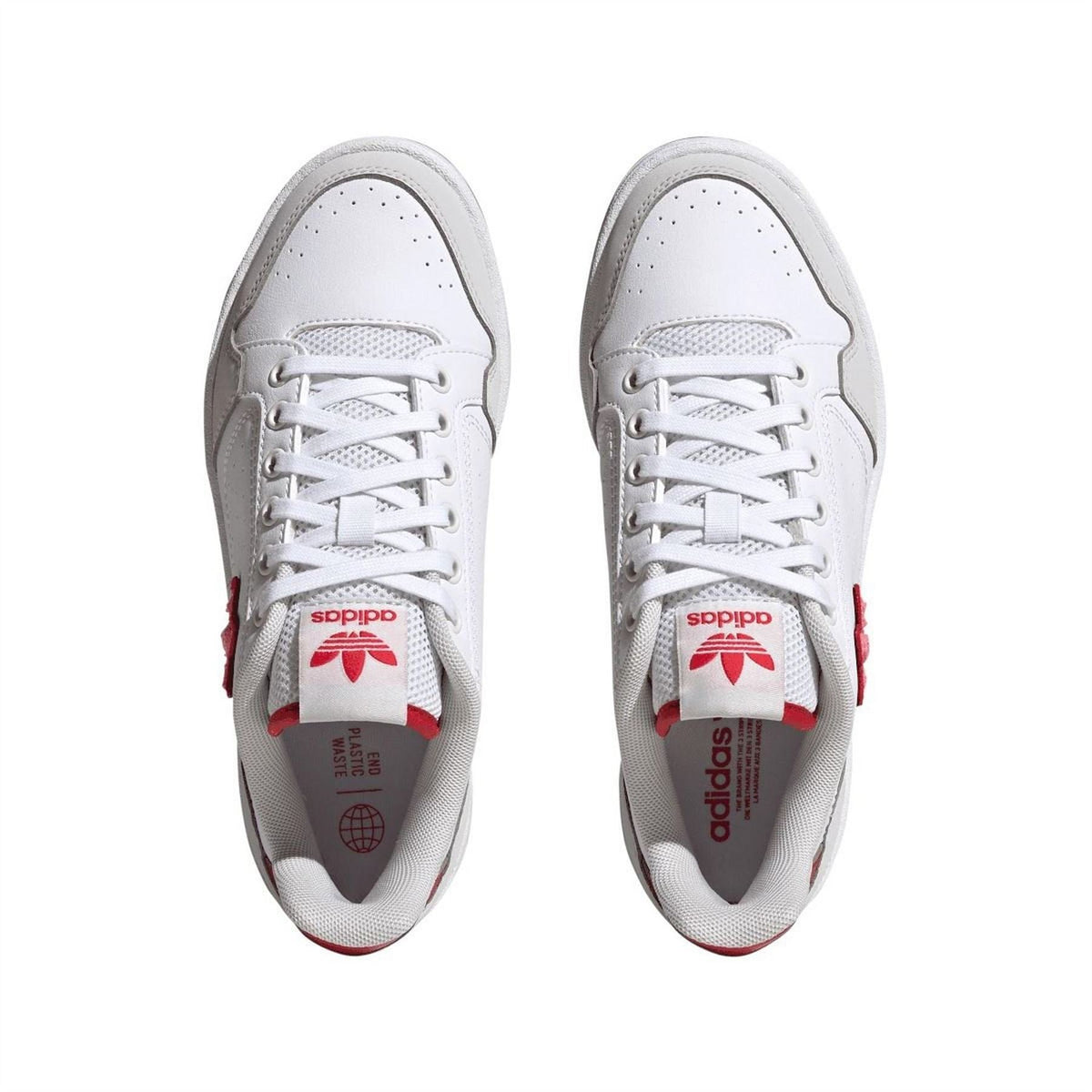 White trainers with lace-up openings and red printed tongue lining